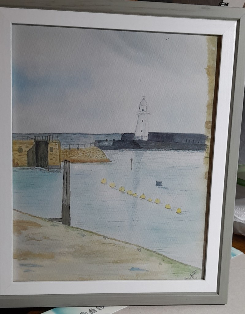 Framed watercolour painting of a harbour with a lighthouse and yellow buoys